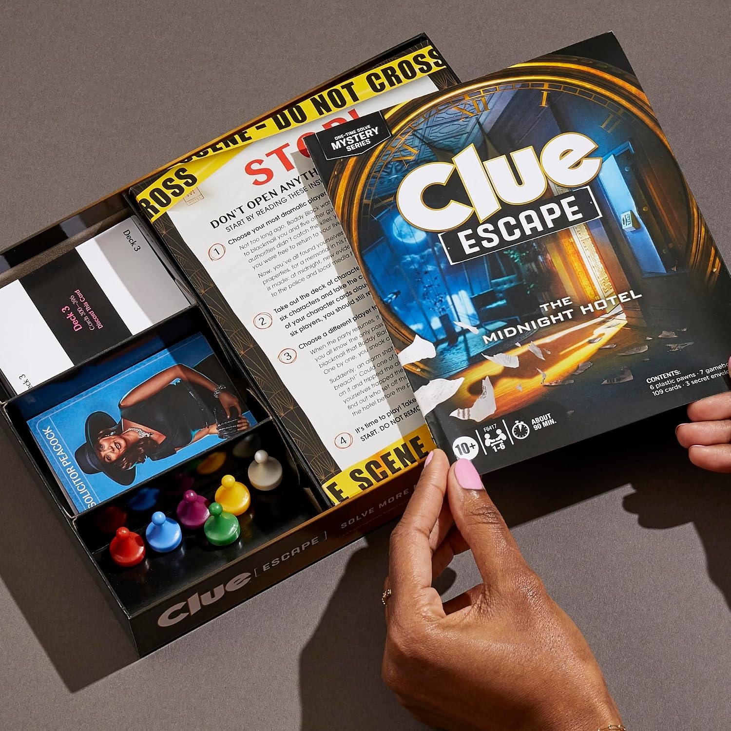 image:imageClue Escape The Midnight Hotel Board Game Clue Escape Room Game 1Time Solve Mystery Games Family Games for Ages 10 16 Players 90 Mins AvgThe Midnight Hotel