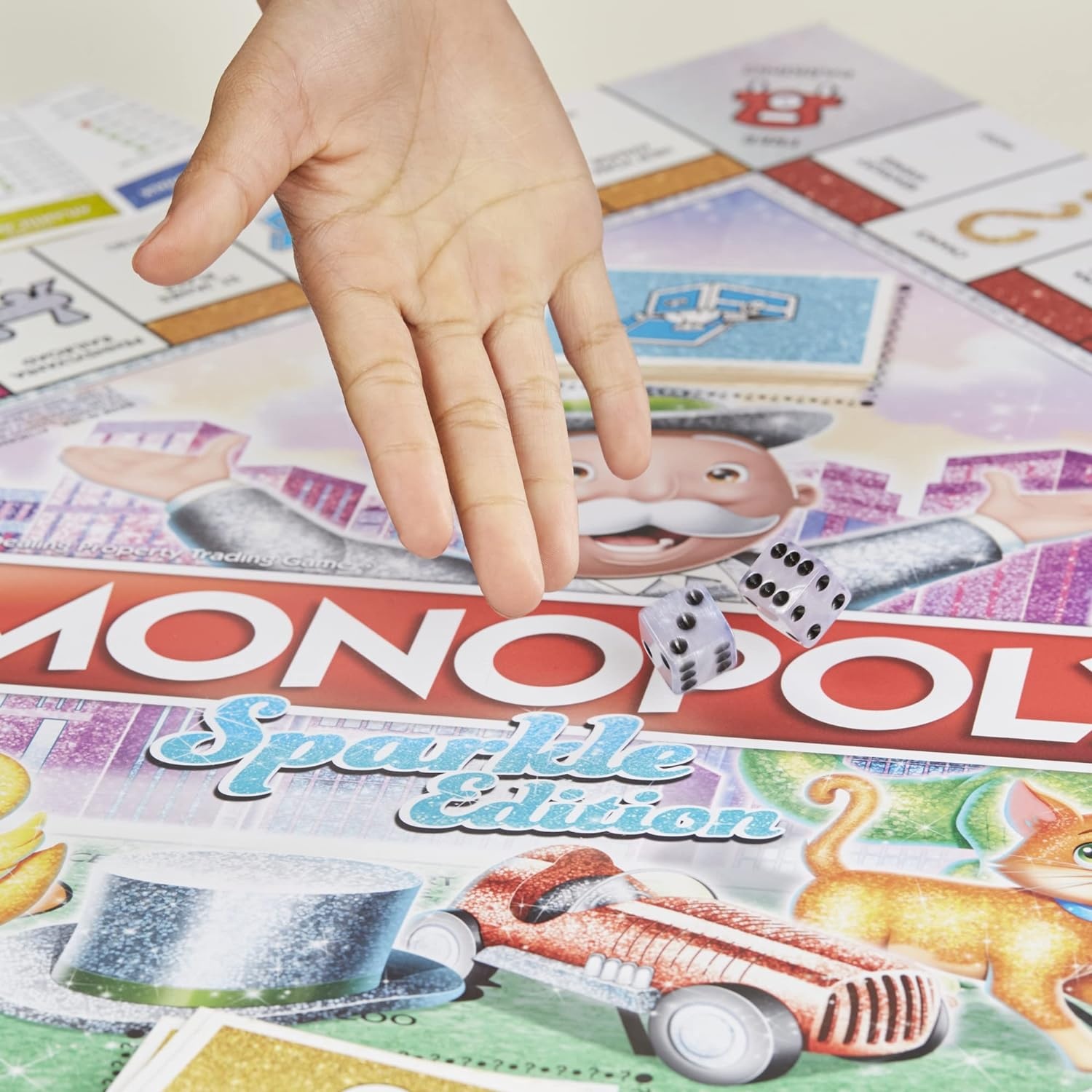 image:imageHasbro Gaming Monopoly Sparkle Edition Board Game Family Games with Glittery Tokens Pearlescent Dice Sparkly Look Amazon Exclusive