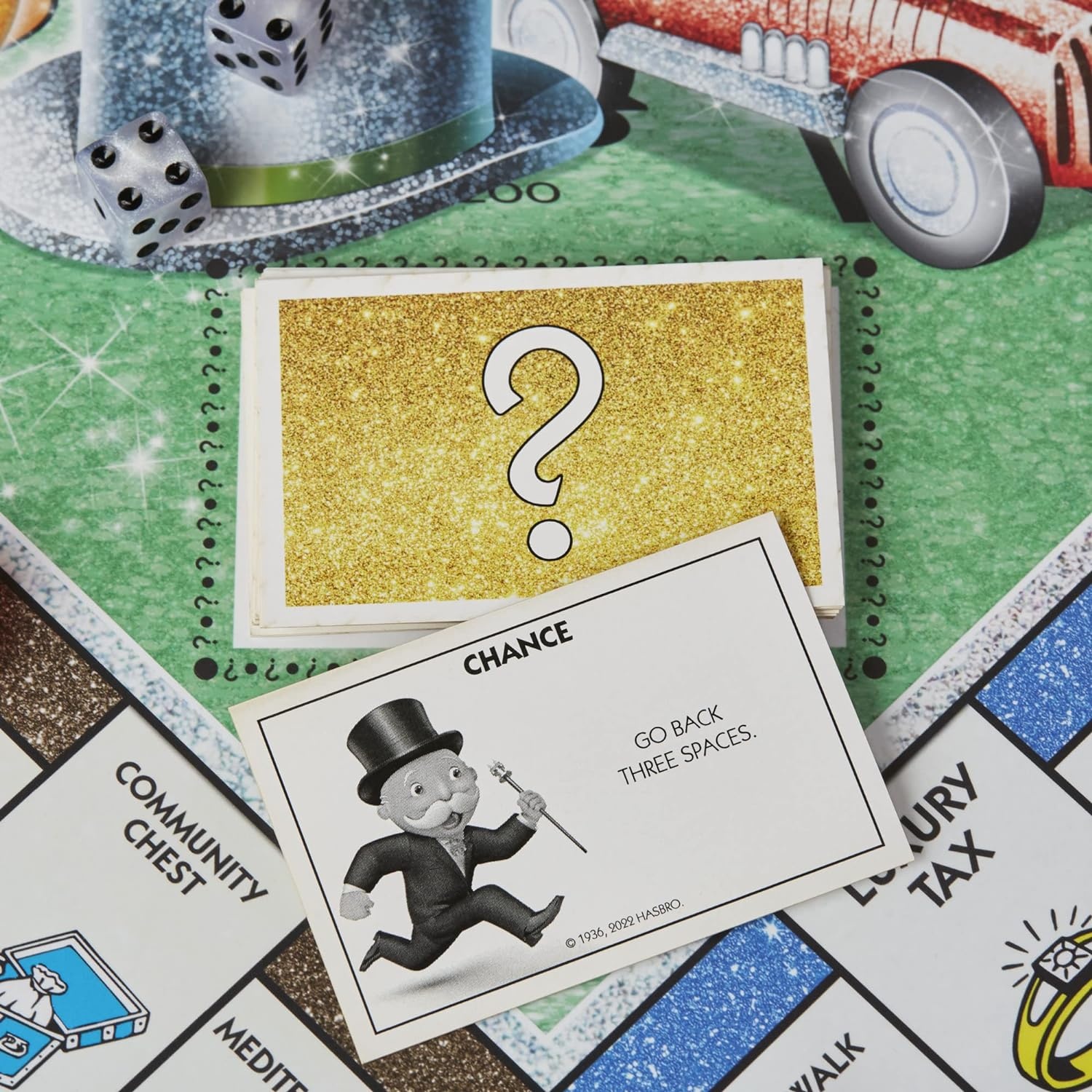 image:imageHasbro Gaming Monopoly Sparkle Edition Board Game Family Games with Glittery Tokens Pearlescent Dice Sparkly Look Amazon Exclusive